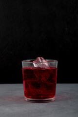 Glass of Americano Alcohol cocktail with red vermouth, bitter, soda water and ice cubes
