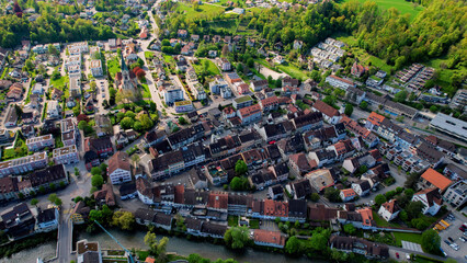 A panoramic aerial view around the old town of the city Laufen in Switzerland on a sunny spring noon