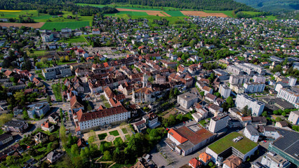 Panorama aerial of the old town of the city Del&eacute;mont in Switzerland on a sunny noon in summer