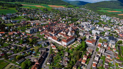 A panoramic aerial view around the old town of the city Delémont in Switzerland on a sunny spring...