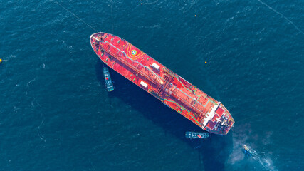 Aerial view oil ship tanker vessel loading and unloading in oil terminal station refinery, Global...