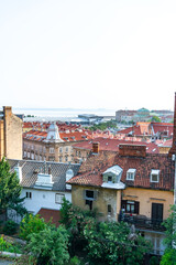 Terracotta rooftops and detailed facades of Rijeka’s old town create a classic European scene,...