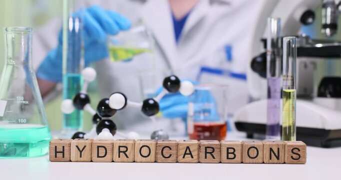 A dedicated scientist conducts experiments with hydrocarbons, showcasing intriguing reactions in the lab