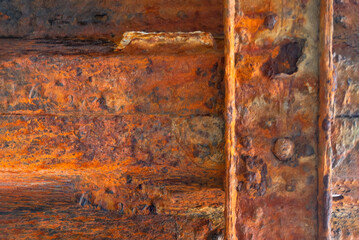 Rust flaking detail. High contrast decay surface.
