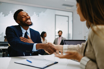 Businessman shaking hands with human resources manager after successful job interview