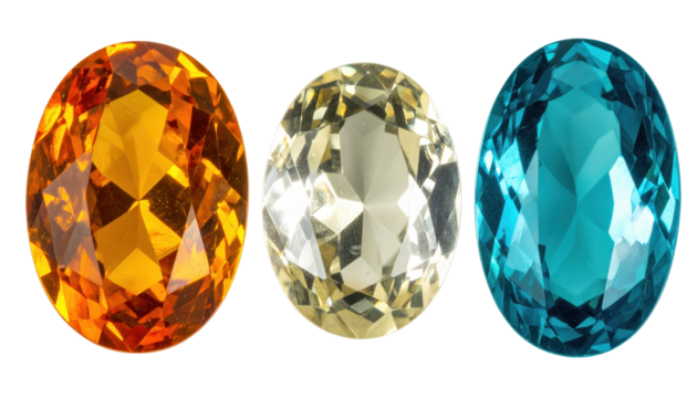 Vibrant Trio of Oval-Cut Gemstones in Orange Yellow and Blue Hue against Transparent Background Illuminated by Internal Light Reflections