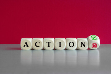 Turned the wooden cube and changes the word ACTION with green positive tick check box and red...