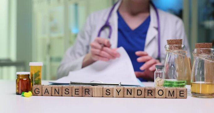 A medical professional is carefully analyzing Ganser syndrome while surrounded by various medications on the table