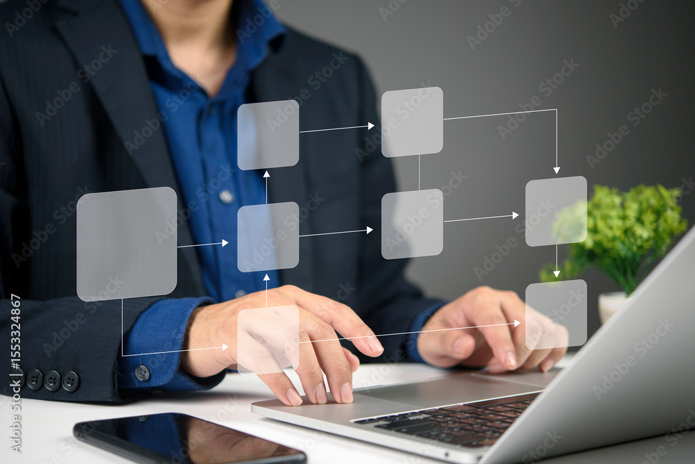Aufkleber business professional using a laptop to create a virtual flowchart, demonstrating digital technology