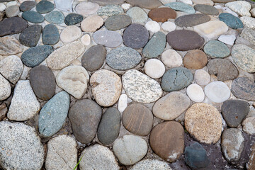 Background of white blue oval shaped pebbles on a clear sunny day. Backgrounds, textures, design.