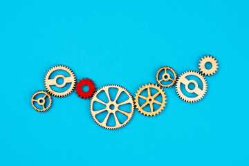 Wooden cogwheels on blue background