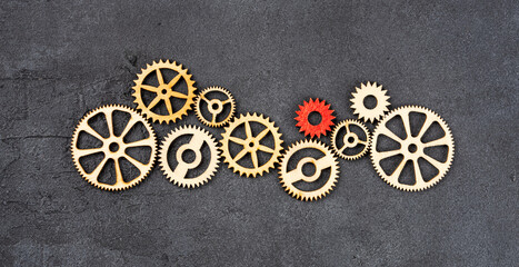 Wooden cogwheels on black background