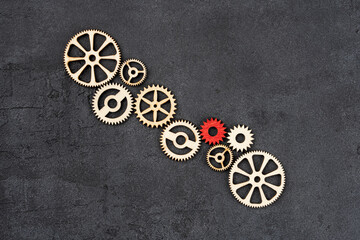 Wooden cogwheels on black background