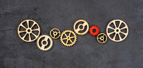 Wooden cogwheels on black background