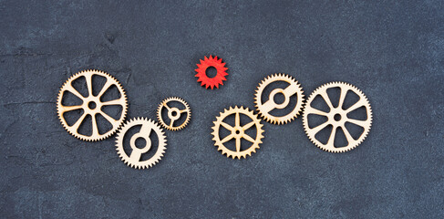 Wooden cogwheels on black background