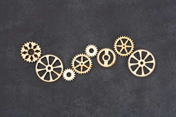  Wooden cogwheels on black background