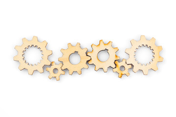 Wooden cogwheels on white background 