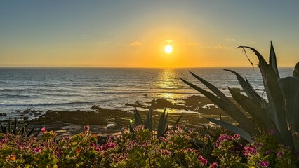 Sun dips into oceans embrace, casting golden omens for Lughnasadh rites, Galician coast's verdant...