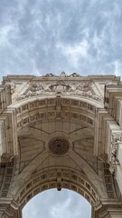 Majestic archway reaches skyward in a symphony of stone, evoking Bastille Day wonders and...