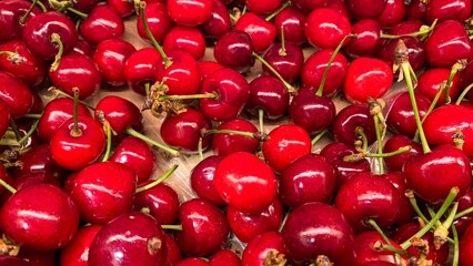 Lush, scarlet cherries cascade like tiny rubies, celebrating summer solstice and the mythical...
