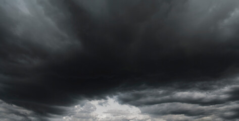 The sky in the rainy season is dark and cloudy, looking scary as if it is going to rain.