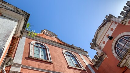 A whimsical fusion of weathered stucco and baroque whimsy, evoking Day of the Buildings or Roof Top...