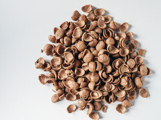 Chocolate cereals corn flakes on white background top view
Cornflakes pile for breakfast, heap of...
