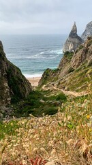 Pathway meandering to secret cove, sculpted cliffs whisper ancient tales, celebrate Earth Day,...