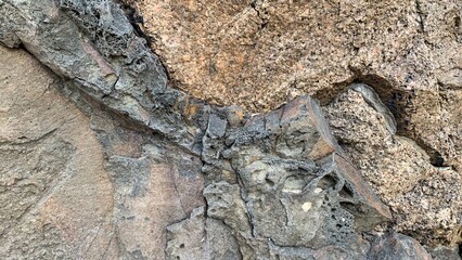 Craggy volcanic rock texture exudes ancient Earth mysteries, ideal for Earth Day or Geology...