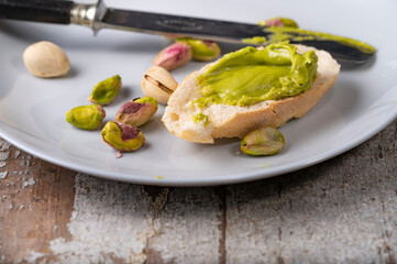 Pistachio cream on baguette, close up shot