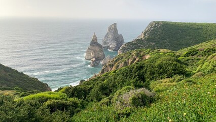 Coastal cliffs embrace azure whispers, echoing ancient pirate lore amidst Iberian midsummer tradition, invoking hidden sirens serenade
