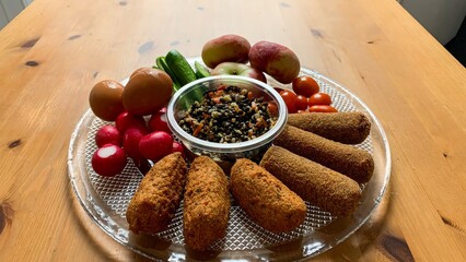 A vibrant platter of crunchy croquettes, radishes, and quinoa salad evokes Dia de los Muertos buffet and autumnal harvest