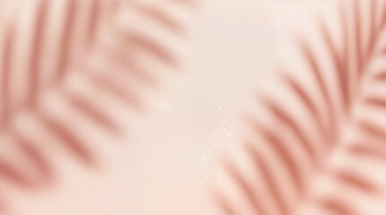 Blurred shadow from palm leaves on the light pink wall. Minimal abstract background for product presentation. Spring and summer.