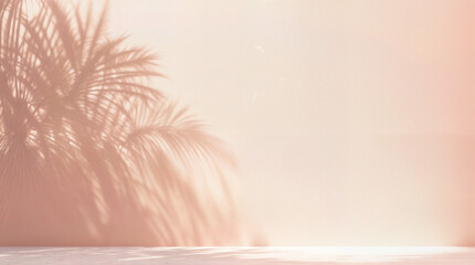 Blurred shadow from palm leaves on the light pink wall. Minimal abstract background for product presentation. Spring and summer.