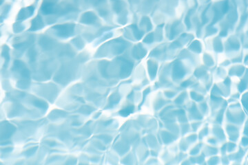 Blue water with ripples on the surface. Defocus blurred transparent blue colored clear calm water...