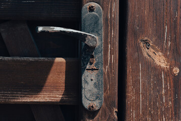old vintage door handle and lock on wooden door