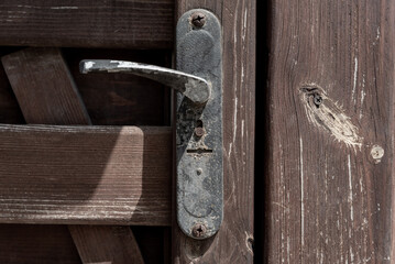 old vintage door handle and lock on wooden door