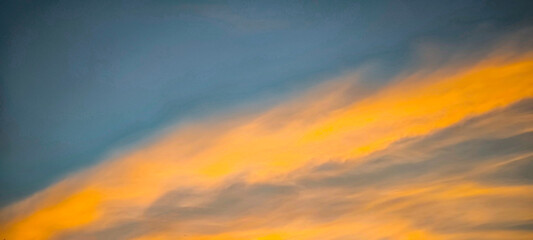 In the evening. the sky and clouds are orange.