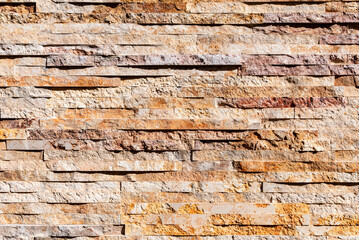 Stacked stone wall texture background horizontal. White stone tile texture brick wall background.