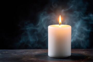 Soft candlelight illuminating dark space with gentle smoke
