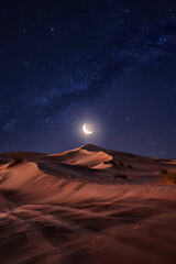 Desert Dunes Under a Crescent Moon and Starry Sky