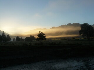 sunrise in the mountains with fog
