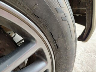 Cracked Car Tire Damage Close-up for Safety Inspection