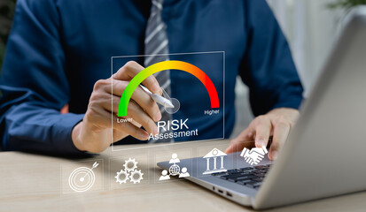 Businessman analyzing risks and opportunities using virtual risk level indicators. Concept of...