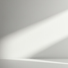 Empty white wall with natural light casting soft shadow creating calm and minimalistic atmosphere in bright room interior
