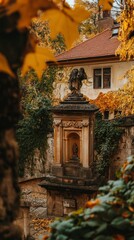 Fototapeta premium Autumnal Courtyard with Angel Statue and Historic Building