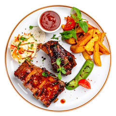 Overhead View of a Plate Featuring Barbecued Ribs Fried Potatoes Grilled Pepper and Salad Garnished with Fresh Herbs