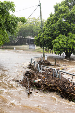 Floodwaters cover a bridge over the Ithaca Creek in the suburb of Red Hill in Brisbane