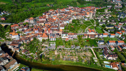A panoramic aerial view around the old town of the city Orbe in Switzerland on a sunny spring noon