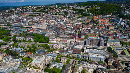 A panoramic aerial view around the old town of the city Lausanne in Switzerland on a sunny spring...